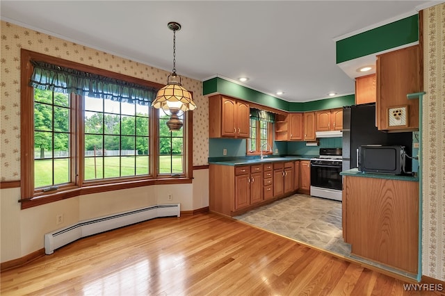 218 Hall Rd, Lancaster, NY 14059 - kitchen featuring white gas range oven, a baseboard radiator, dark countertops, light wood finished floors, and wallpapered walls
