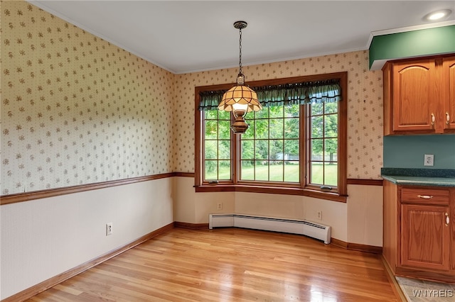 218 Hall Rd, Lancaster, NY 14059 - unfurnished dining area featuring baseboard heating, wallpapered walls, ornamental molding, and light wood-style floors