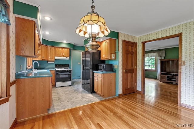 218 Hall Rd, Lancaster, NY 14059 - kitchen featuring white range with gas stovetop, stainless steel microwave, black fridge with ice dispenser, light wood finished floors, and wallpapered walls