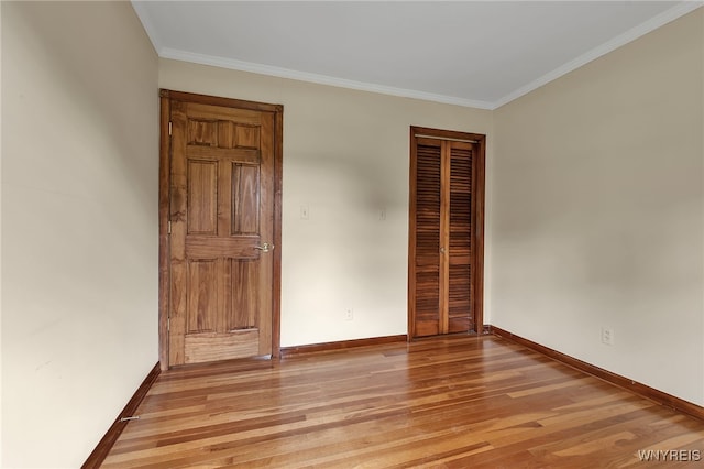 218 Hall Rd, Lancaster, NY 14059 - unfurnished bedroom with light wood-type flooring, a closet, and crown molding