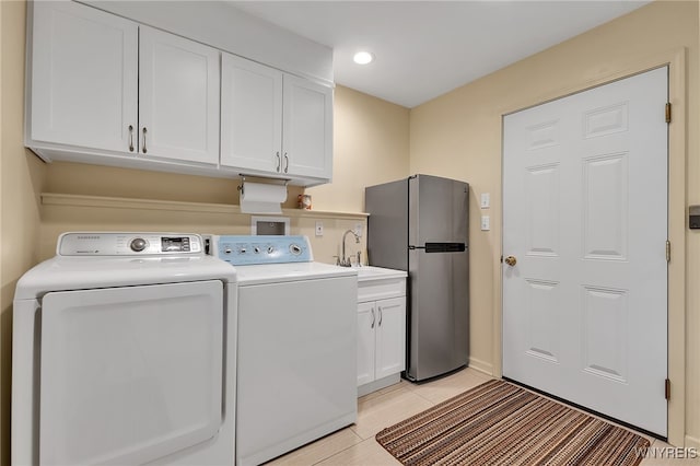 218 Hall Rd, Lancaster, NY 14059 - washroom featuring cabinet space, washing machine and dryer, recessed lighting, and light tile patterned floors