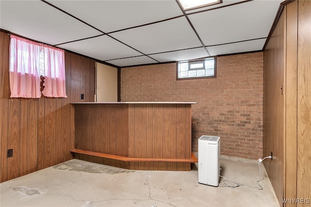 218 Hall Rd, Lancaster, NY 14059 - indoor dry bar with brick wall, concrete floors, and wooden walls