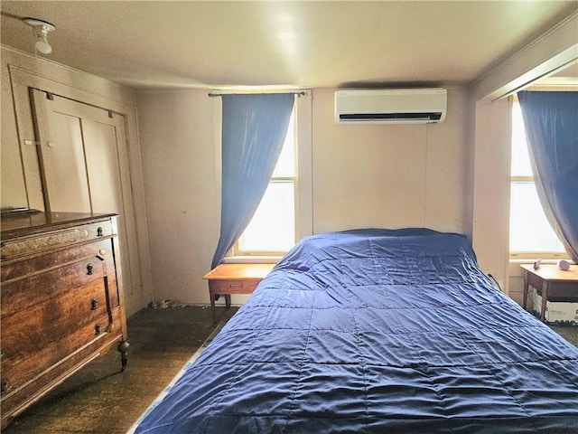 52 Maple Ave, Cohocton, NY 14826 - bedroom featuring a wall unit AC and wood finished floors
