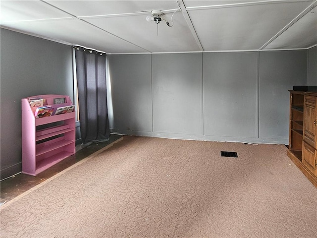 52 Maple Ave, Cohocton, NY 14826 - unfurnished living room featuring carpet flooring and a decorative wall