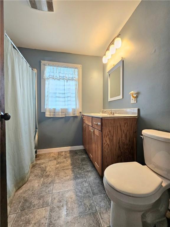 52 Maple Ave, Cohocton, NY 14826 - bathroom featuring vanity, stone finish floors, and a shower with curtain