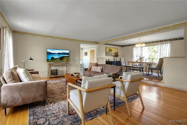 11131 Harlow Rd, Darien, NY 14004 - living area with wood finished floors and a chandelier