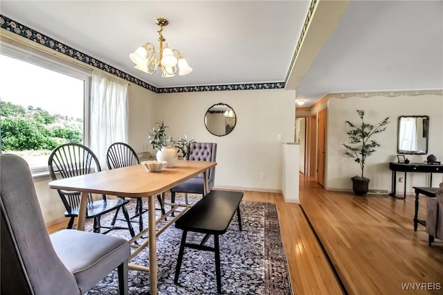 11131 Harlow Rd, Darien, NY 14004 - dining space with a chandelier and light wood-type flooring