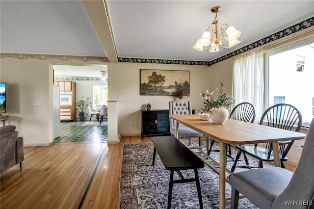 11131 Harlow Rd, Darien, NY 14004 - dining room with a chandelier and light wood-style flooring