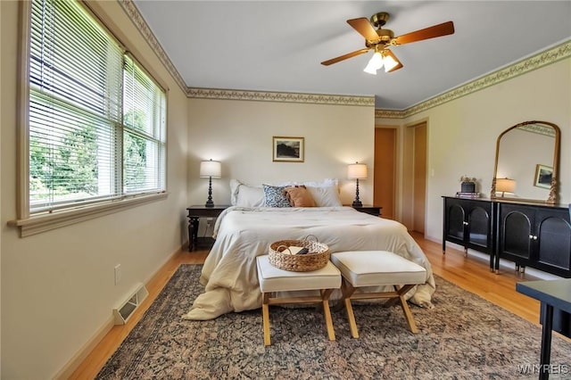 11131 Harlow Rd, Darien, NY 14004 - bedroom featuring light wood finished floors, crown molding, and ceiling fan