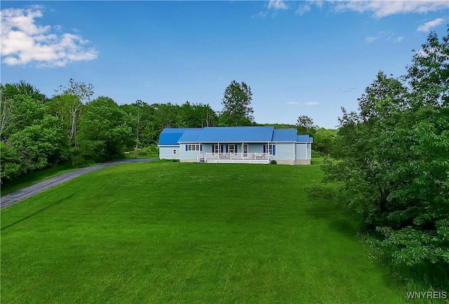 11131 Harlow Rd, Darien, NY 14004 - view of front of property featuring a front yard, driveway, a metal roof, and a porch