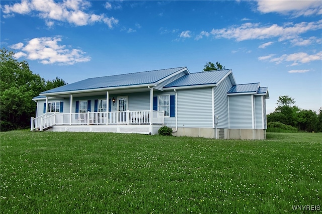 11131 Harlow Rd, Darien, NY 14004 - view of front of home with covered porch, a front lawn, and a metal roof