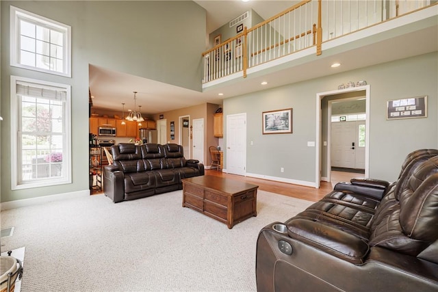 16 Hepburn Ln, Pittsford, NY 14534 - living room with a high ceiling, recessed lighting, and light carpet