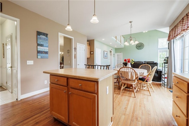 16 Hepburn Ln, Pittsford, NY 14534 - kitchen with light wood finished floors, hanging light fixtures, light countertops, a center island, and recessed lighting