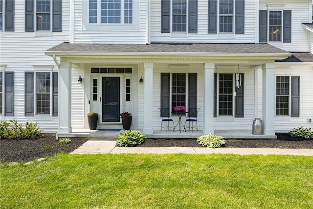 16 Hepburn Ln, Pittsford, NY 14534 - property entrance with covered porch, a yard, and a shingled roof