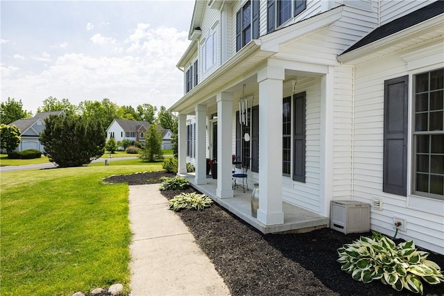 16 Hepburn Ln, Pittsford, NY 14534 - view of home's exterior with a porch and a lawn