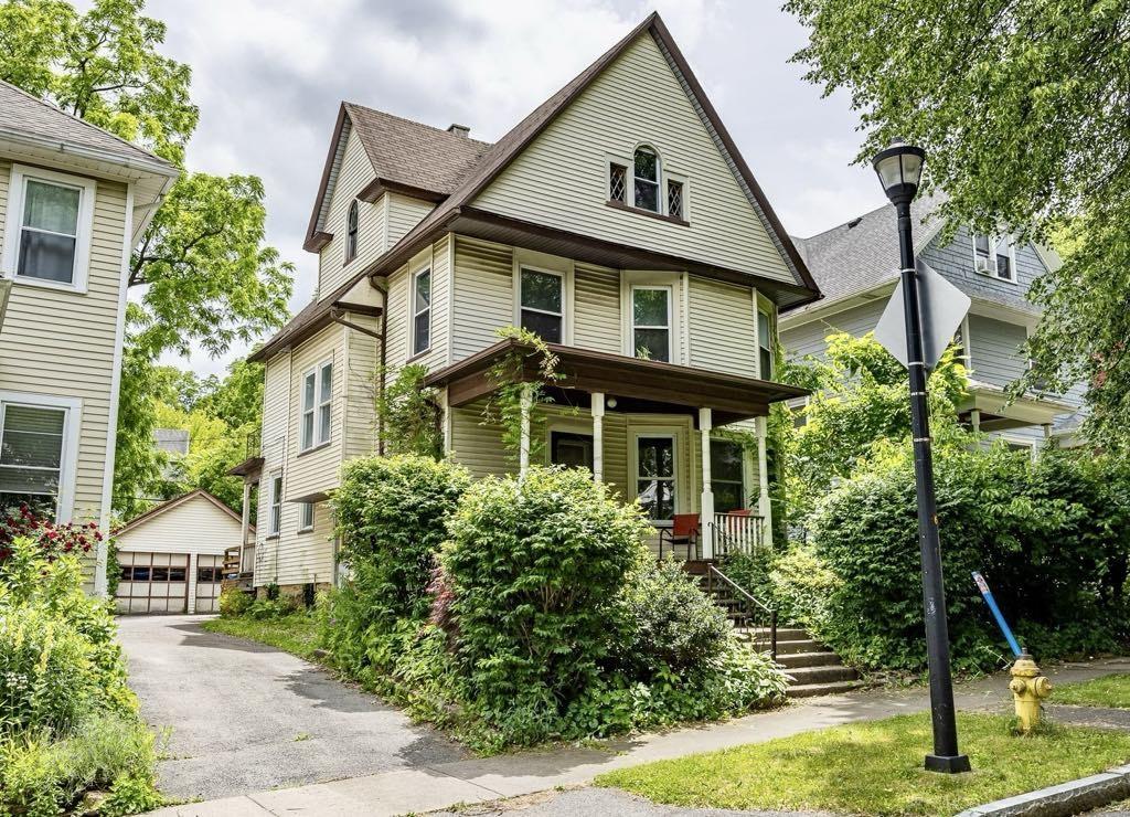48 Rosedale St, Rochester, NY 14620 - view of front of home with a porch, an outdoor structure, a detached garage, and stairway