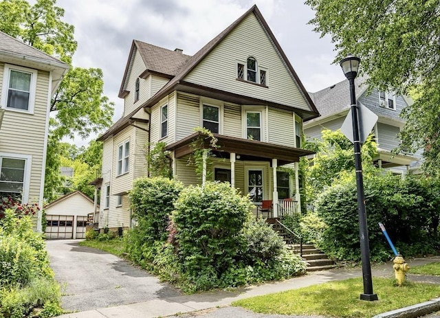 48 Rosedale St, Rochester, NY 14620 - view of front of home with a porch, an outdoor structure, a detached garage, and stairway
