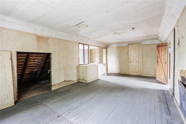 48 Rosedale St, Rochester, NY 14620 - empty room with hardwood / wood-style floors and wallpapered walls