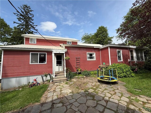 4935 N Jefferson St, Richland, NY 13142 - back of property featuring a metal roof and entry steps
