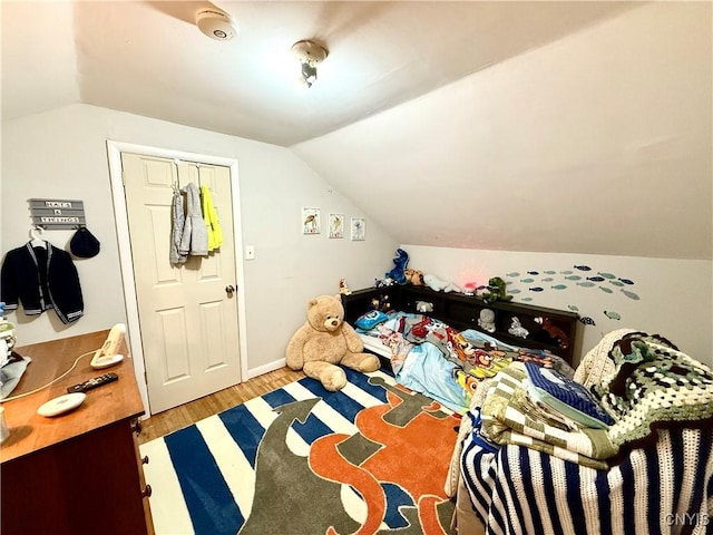 4935 N Jefferson St, Richland, NY 13142 - bedroom with vaulted ceiling and wood finished floors