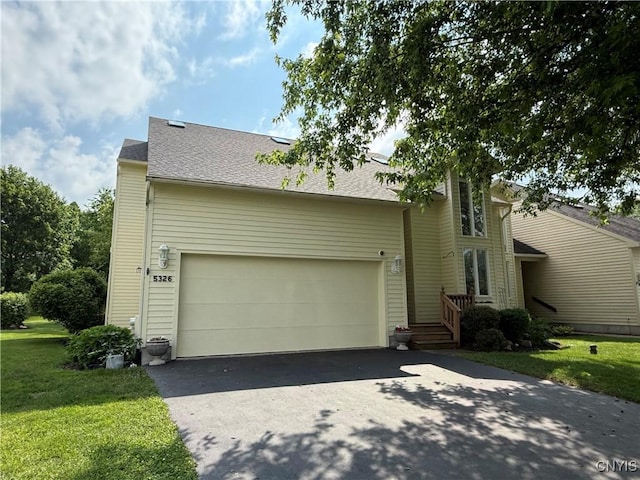 5326 Bunker Hill Way, Onondaga, NY 13207 - view of front of house featuring asphalt driveway, an attached garage, a front yard, and roof with shingles