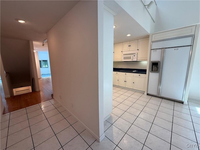 5326 Bunker Hill Way, Onondaga, NY 13207 - hallway featuring light tile patterned floors, recessed lighting, and a baseboard radiator