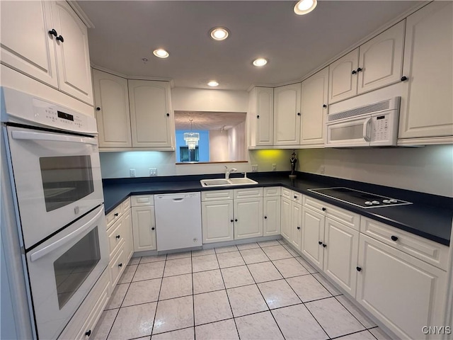 5326 Bunker Hill Way, Onondaga, NY 13207 - kitchen featuring white appliances, dark countertops, light tile patterned flooring, white cabinets, and recessed lighting