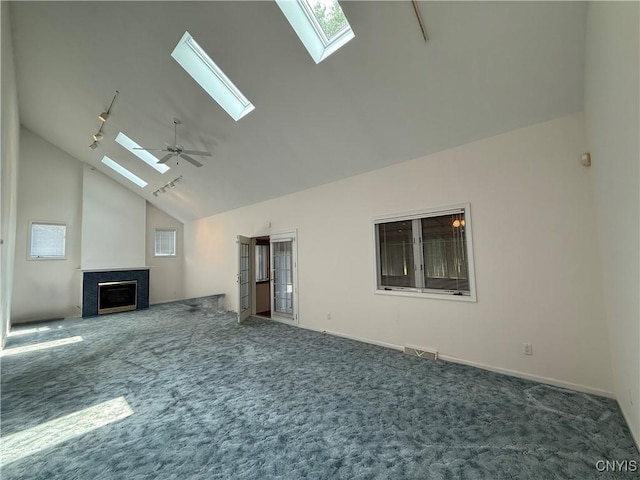 5326 Bunker Hill Way, Onondaga, NY 13207 - unfurnished living room featuring a skylight, carpet floors, a fireplace, and high vaulted ceiling