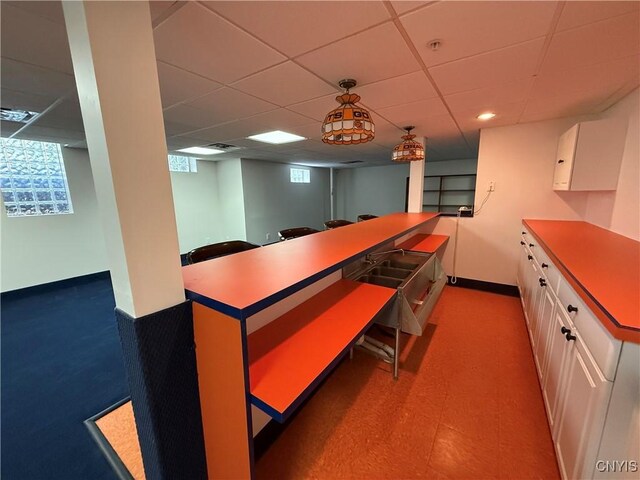 5326 Bunker Hill Way, Onondaga, NY 13207 - kitchen with white cabinets and a paneled ceiling