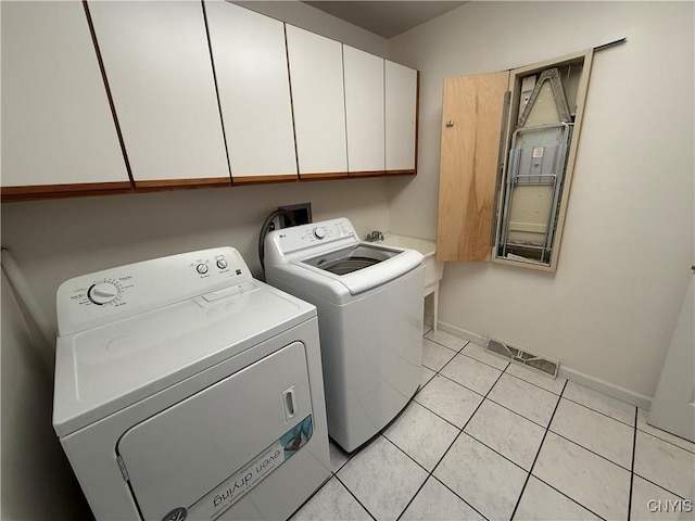 5326 Bunker Hill Way, Onondaga, NY 13207 - laundry room with cabinet space, separate washer and dryer, and light tile patterned floors