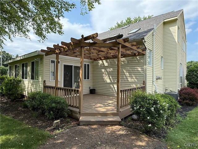 5326 Bunker Hill Way, Onondaga, NY 13207 - back of property with a deck, a pergola, and a shingled roof