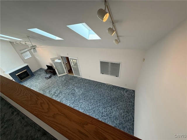 5326 Bunker Hill Way, Onondaga, NY 13207 - unfurnished living room with a skylight, vaulted ceiling, and carpet flooring
