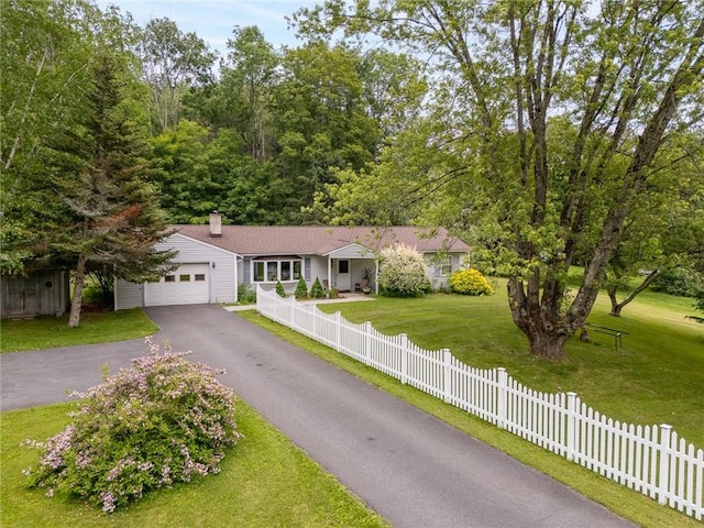 226 Academy St, Middletown, NY 12455 - ranch-style house with asphalt driveway, an attached garage, and a chimney