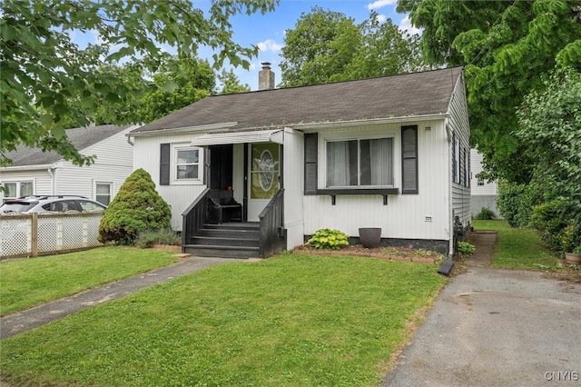 107 Edgeware Rd, Salina, NY 13208 - bungalow-style home with a chimney, a front yard, and a shingled roof