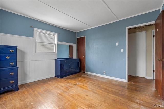 107 Edgeware Rd, Salina, NY 13208 - unfurnished bedroom featuring hardwood / wood-style floors, crown molding, and a wainscoted wall