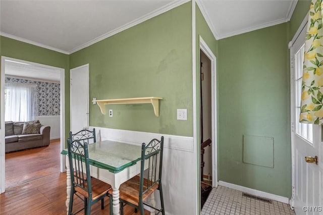 107 Edgeware Rd, Salina, NY 13208 - dining room featuring ornamental molding, wainscoting, and wood finished floors