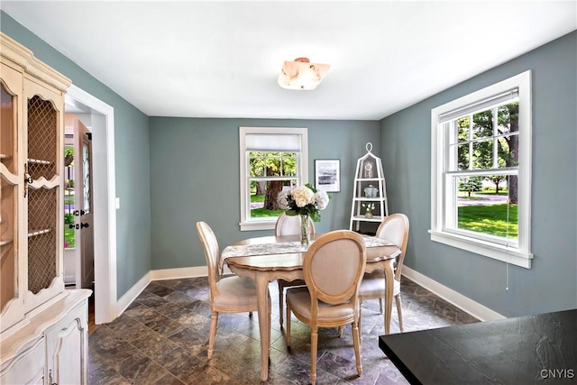 6 Orchard Rd, Skaneateles, NY 13152 - dining room with plenty of natural light and dark stone finish flooring