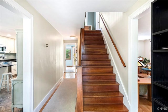 6 Orchard Rd, Skaneateles, NY 13152 - staircase featuring baseboards