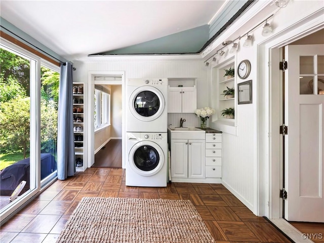 6 Orchard Rd, Skaneateles, NY 13152 - washroom with cabinet space and stacked washer and clothes dryer