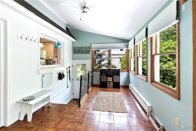 6 Orchard Rd, Skaneateles, NY 13152 - doorway to outside featuring baseboard heating, lofted ceiling, healthy amount of natural light, a baseboard radiator, and ceiling fan
