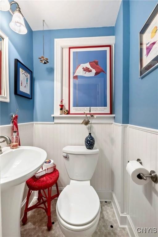 6 Orchard Rd, Skaneateles, NY 13152 - bathroom featuring a wainscoted wall and toilet
