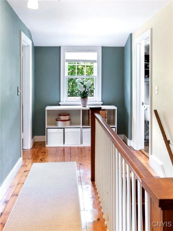 6 Orchard Rd, Skaneateles, NY 13152 - hallway featuring light wood finished floors and an upstairs landing