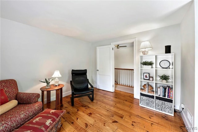 6 Orchard Rd, Skaneateles, NY 13152 - living area with an upstairs landing, hardwood / wood-style flooring, and ceiling fan