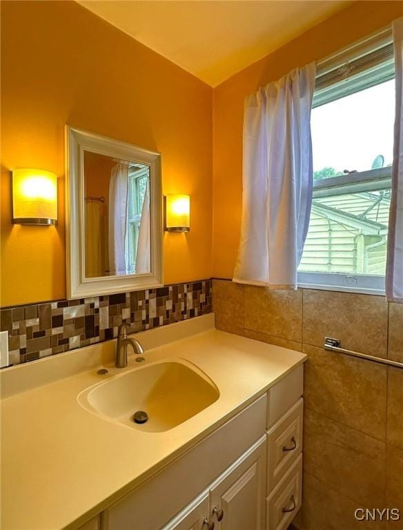 2132 Sinclair Ave, Whitestown, NY 13502 - bathroom with vanity, tile walls, and backsplash