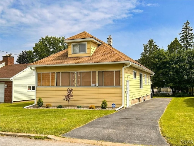 2132 Sinclair Ave, Whitestown, NY 13502 - view of front of house with a chimney, a front yard, and roof with shingles