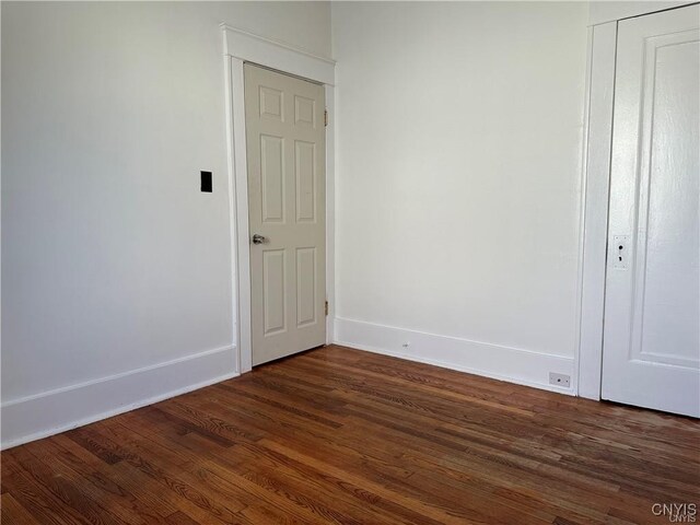 2132 Sinclair Ave, Whitestown, NY 13502 - unfurnished room with dark wood-style flooring and baseboards