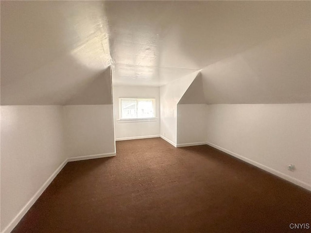 2132 Sinclair Ave, Whitestown, NY 13502 - additional living space with vaulted ceiling and dark carpet