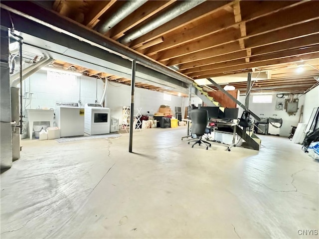 230 Thornton Cir S, Camillus, NY 13031 - below grade area featuring washer and clothes dryer and a sink