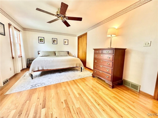 230 Thornton Cir S, Camillus, NY 13031 - bedroom with light wood-style flooring, crown molding, a closet, and ceiling fan