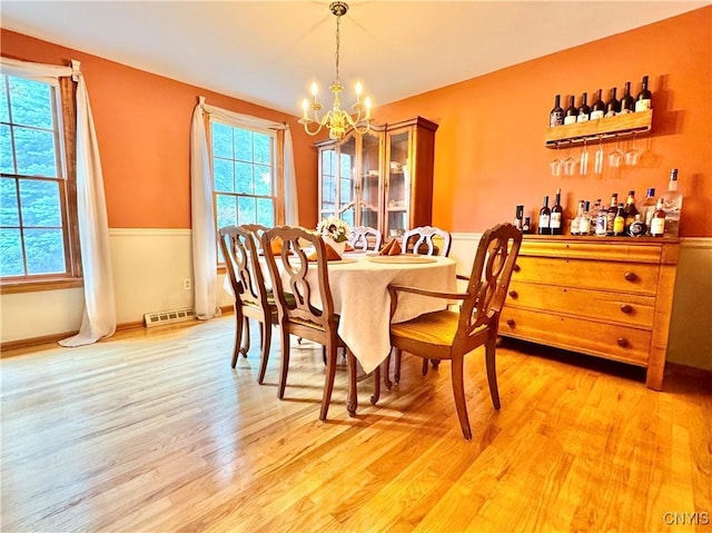 230 Thornton Cir S, Camillus, NY 13031 - dining room with a chandelier and light wood-style flooring